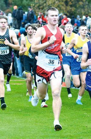 Jaxon Hornby runs at cross nation state meet