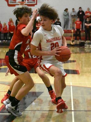 Three straight regional titles for Marshall boys basketball